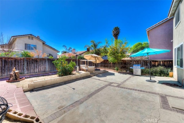 view of patio with a fenced backyard