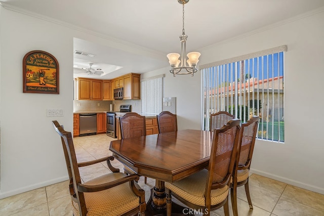 dining space featuring light tile patterned floors, ornamental molding, visible vents, and baseboards