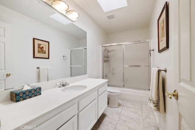 full bath with tile patterned flooring, toilet, bath / shower combo with glass door, a skylight, and visible vents