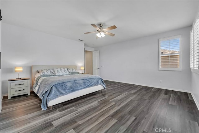 bedroom with ceiling fan, dark wood-type flooring, visible vents, and baseboards