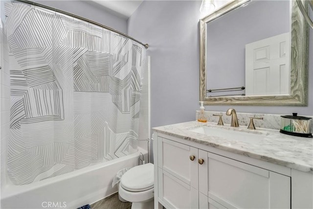 bathroom with toilet, shower / bath combination with curtain, and vanity