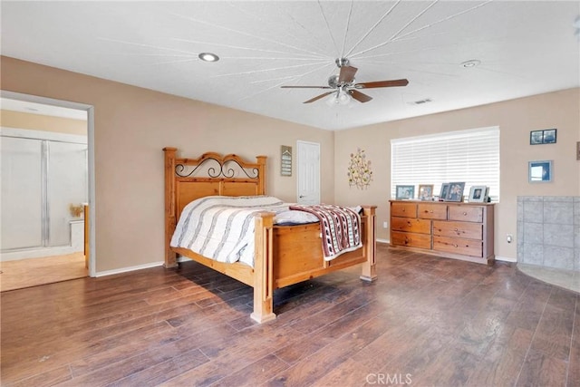 bedroom with dark wood-type flooring, baseboards, and a ceiling fan