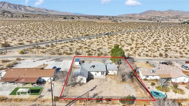 drone / aerial view featuring a residential view and a mountain view