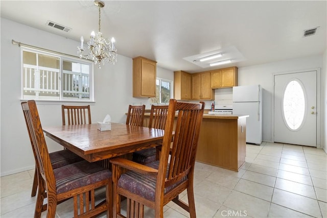 5018 Bluebird Ln, Paso Robles, CA 93446 - dining room featuring a chandelier and light tile patterned floors
