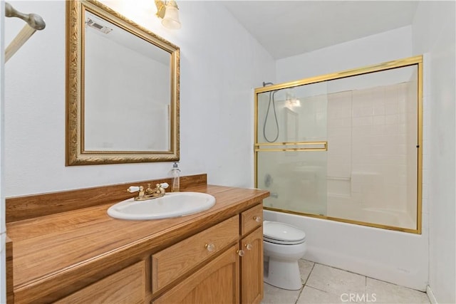 5018 Bluebird Ln, Paso Robles, CA 93446 - bathroom featuring toilet, tile patterned flooring, vanity, and enclosed tub / shower combo