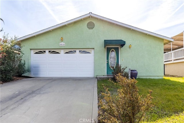 ranch-style home featuring central AC unit, stucco siding, concrete driveway, and a garage