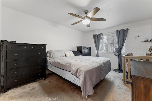 bedroom featuring ceiling fan and light colored carpet