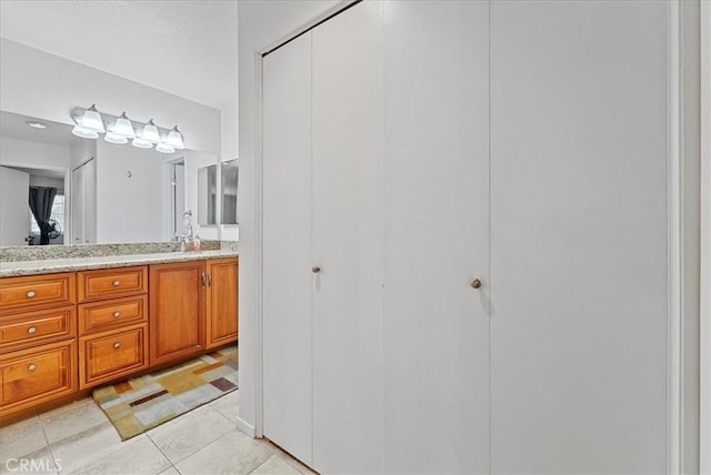 bathroom with vanity and tile patterned floors