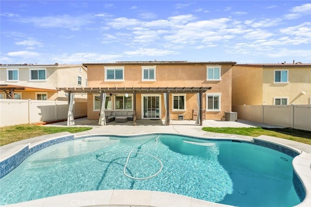 back of house featuring a fenced in pool, a patio, stucco siding, central AC, and a fenced backyard