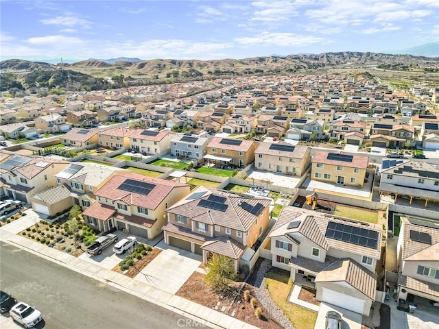 drone / aerial view featuring a residential view and a mountain view