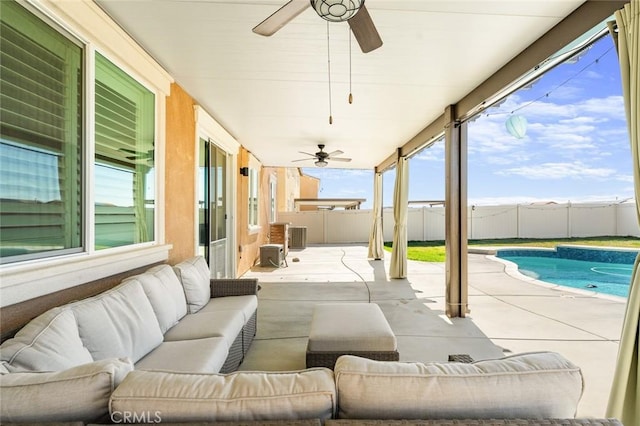 view of patio featuring ceiling fan, an outdoor hangout area, a fenced backyard, and a fenced in pool