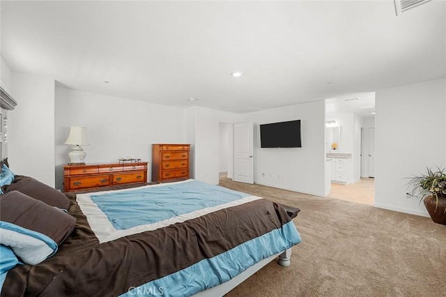 bedroom with light carpet, baseboards, visible vents, ensuite bathroom, and recessed lighting