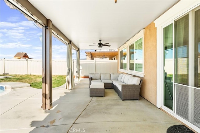 view of patio / terrace featuring an outdoor hangout area, a fenced backyard, and a ceiling fan