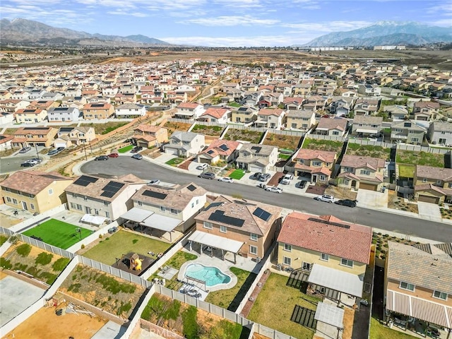 drone / aerial view with a residential view and a mountain view