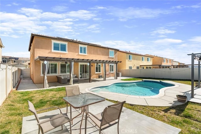 back of property featuring a patio, a fenced backyard, a fenced in pool, a pergola, and stucco siding