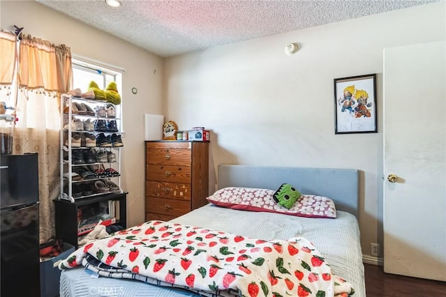607 S Indian Hill Blvd Unit A, Claremont, CA 91711 - bedroom with freestanding refrigerator, a textured ceiling, and wood finished floors