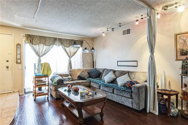 607 S Indian Hill Blvd Unit A, Claremont, CA 91711 - living room featuring rail lighting, a textured ceiling, and wood finished floors