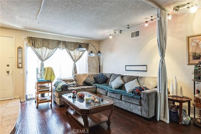 607 S Indian Hill Blvd Unit A, Claremont, CA 91711 - living area featuring rail lighting, a textured ceiling, and wood finished floors