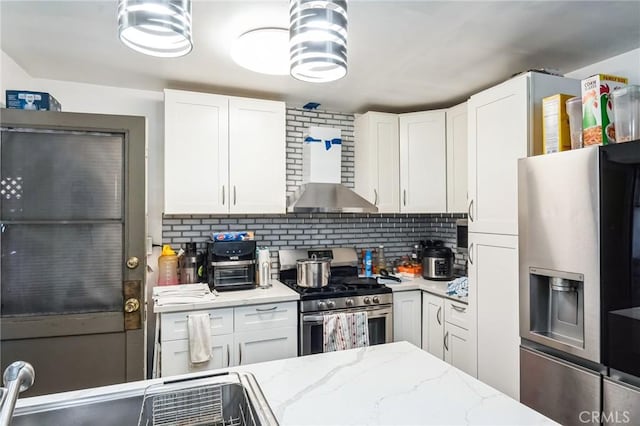 607 S Indian Hill Blvd Unit A, Claremont, CA 91711 - kitchen featuring appliances with stainless steel finishes, white cabinetry, backsplash, and light stone countertops
