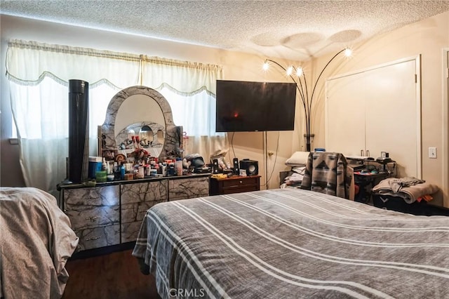 607 S Indian Hill Blvd Unit A, Claremont, CA 91711 - bedroom featuring a textured ceiling, dark wood-style floors, and multiple windows