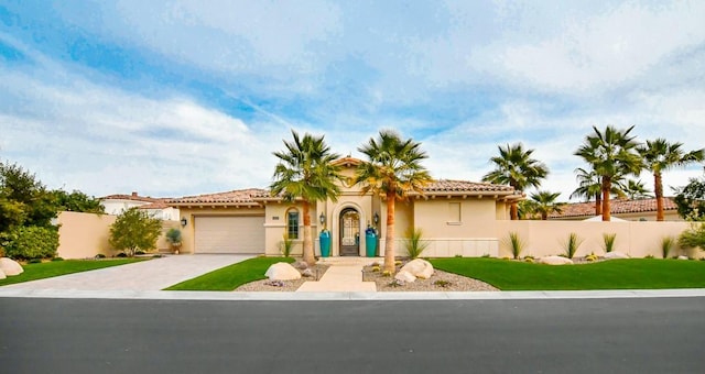 75851 Via Pisa, Indian Wells, CA 92210 - mediterranean / spanish home featuring fence, driveway, an attached garage, and stucco siding