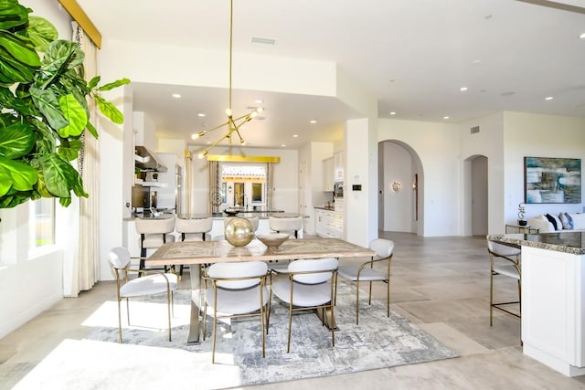 75851 Via Pisa, Indian Wells, CA 92210 - dining space with arched walkways, visible vents, and recessed lighting