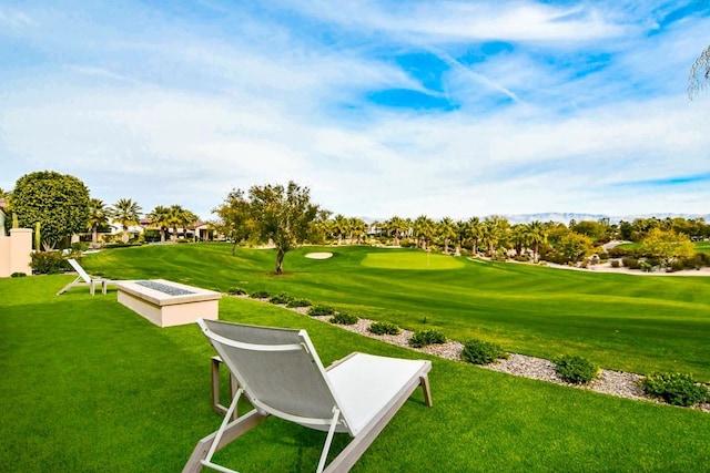 75851 Via Pisa, Indian Wells, CA 92210 - surrounding community featuring view of golf course and a lawn