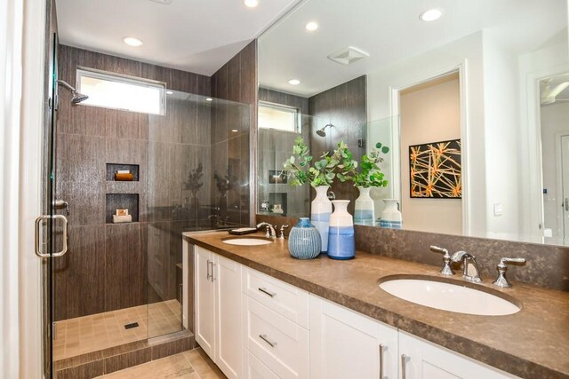 75851 Via Pisa, Indian Wells, CA 92210 - bathroom with double vanity, a shower stall, a sink, and recessed lighting