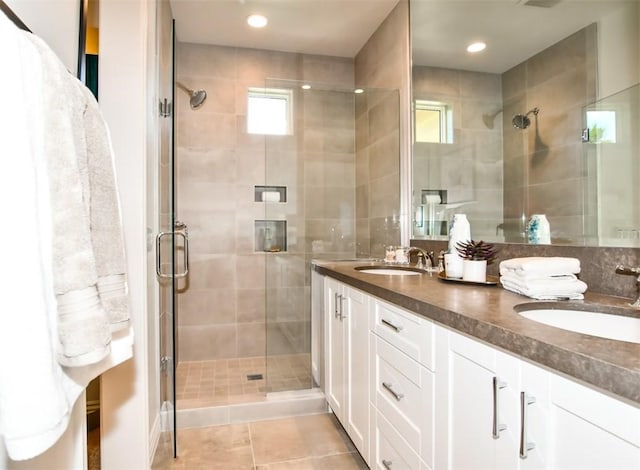 75851 Via Pisa, Indian Wells, CA 92210 - bathroom with a wealth of natural light, a stall shower, a sink, and double vanity