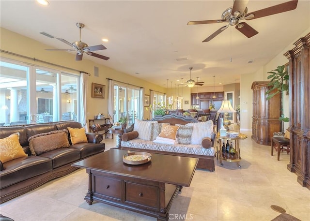 living area with visible vents and recessed lighting