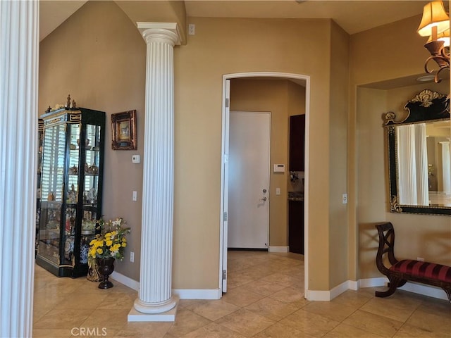 37305 Calle De Lobo, Murrieta, CA 92562 - hall featuring ornate columns, arched walkways, light tile patterned floors, and baseboards