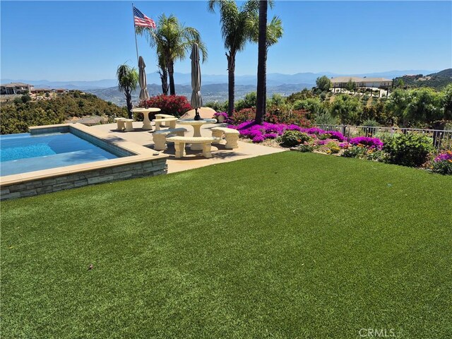 37305 Calle De Lobo, Murrieta, CA 92562 - view of yard featuring a mountain view, an outdoor pool, and a patio area