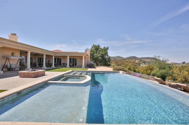 37305 Calle De Lobo, Murrieta, CA 92562 - view of swimming pool with a fire pit, a patio area, a ceiling fan, and a pool with connected hot tub