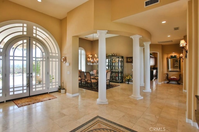 37305 Calle De Lobo, Murrieta, CA 92562 - foyer with ornate columns, french doors, a towering ceiling, baseboards, and recessed lighting