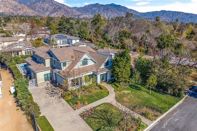 birds eye view of property with a residential view and a mountain view