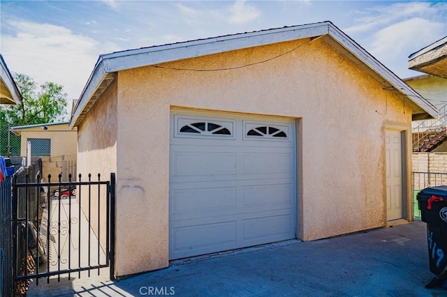 detached garage with fence