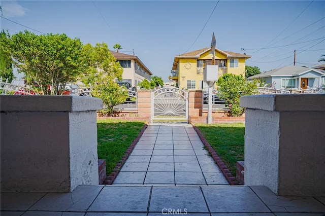 exterior space featuring a lawn and fence