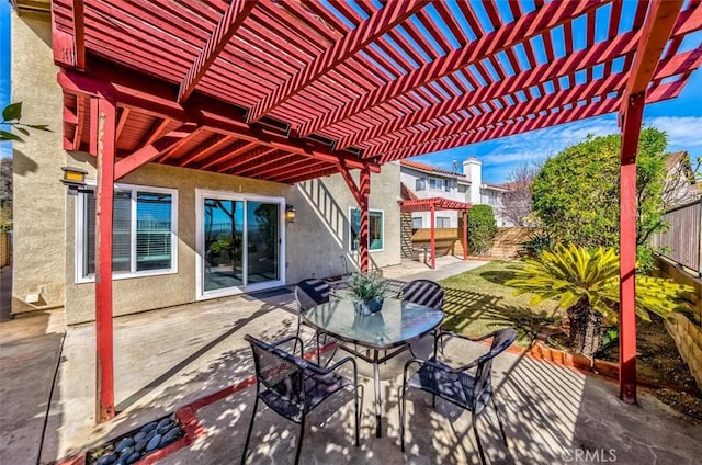 view of patio / terrace with outdoor dining space, a fenced backyard, and a pergola