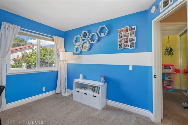 bedroom with carpet flooring, visible vents, and baseboards