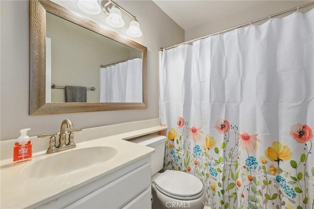 bathroom with a shower with curtain, vanity, and toilet