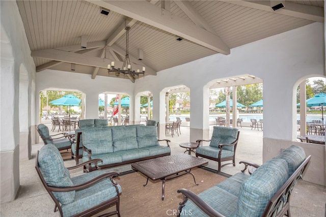 view of patio / terrace featuring a water view, outdoor dining area, an outdoor hangout area, and a ceiling fan