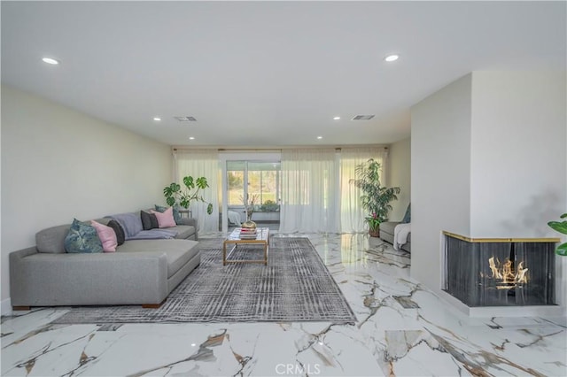 living room with marble finish floor, visible vents, and recessed lighting