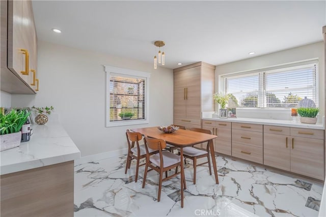 dining room with marble finish floor, baseboards, and recessed lighting