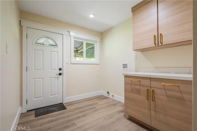 interior space with light wood-style floors and baseboards