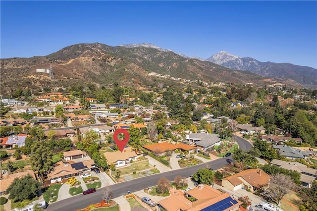 birds eye view of property with a residential view and a mountain view