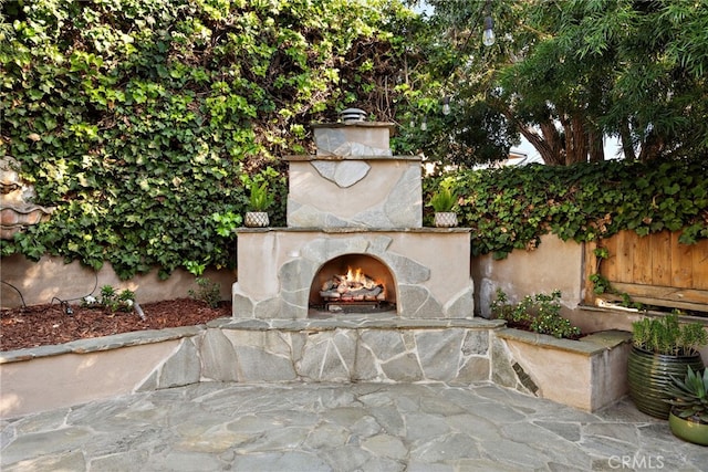 1020 La Mirada St, Laguna Beach, CA 92651 - view of patio / terrace with an outdoor stone fireplace