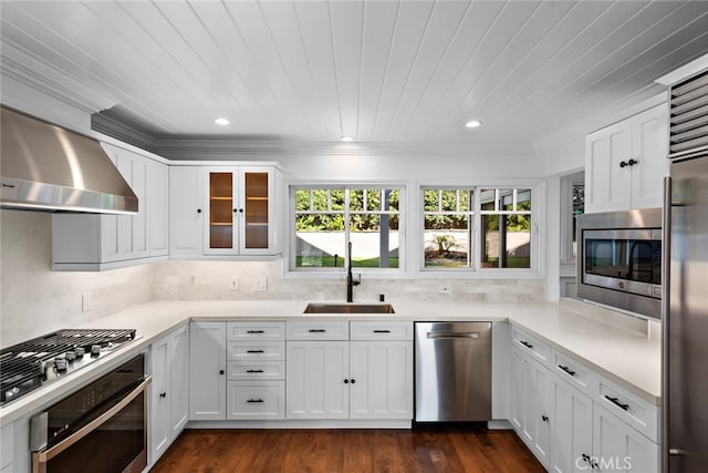 1020 La Mirada St, Laguna Beach, CA 92651 - kitchen featuring appliances with stainless steel finishes, a sink, wall chimney range hood, light countertops, and white cabinets