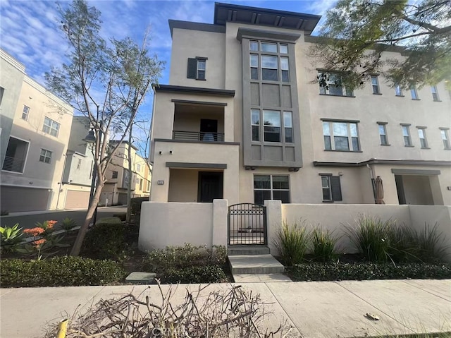 view of building exterior featuring a fenced front yard