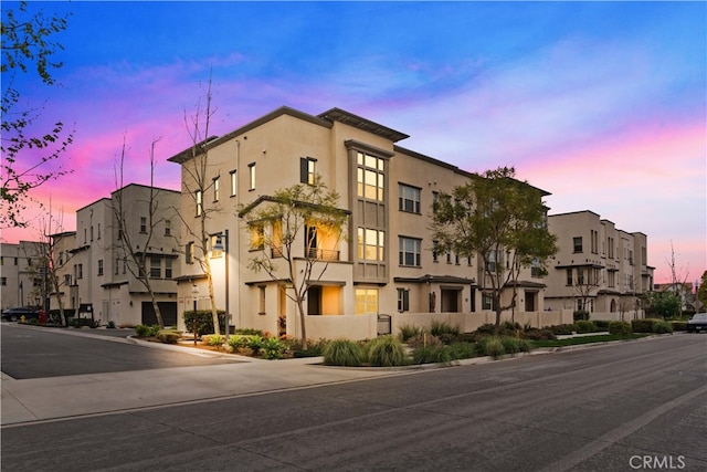 view of property at dusk