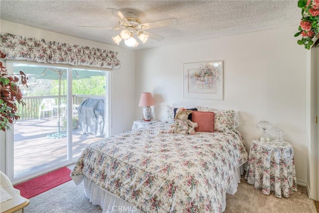 bedroom with light carpet, access to exterior, a ceiling fan, and a textured ceiling